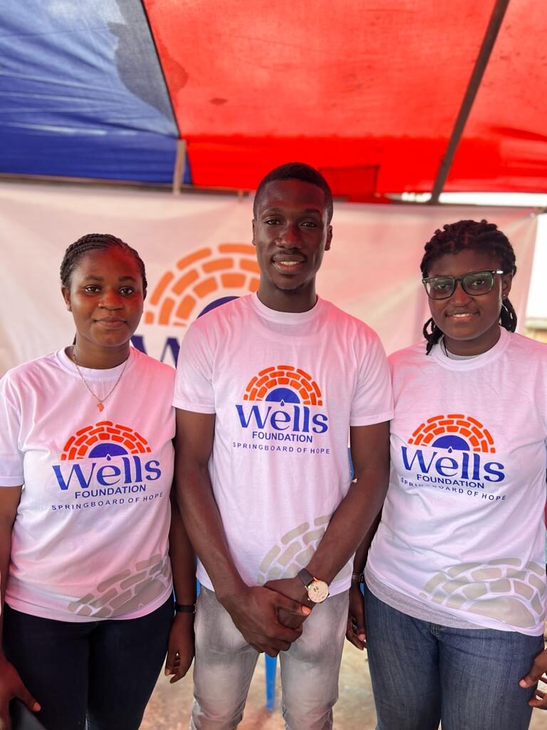 Wells Foundation volunteers at a community outreach event in Ghana