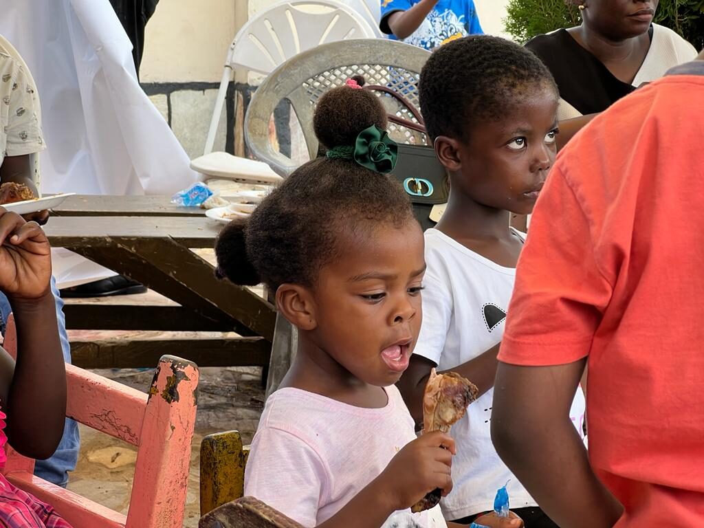 Children enjoying treats at a Wells Foundation community event