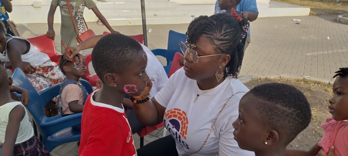 Face painting fun for children at a Wells Foundation community day