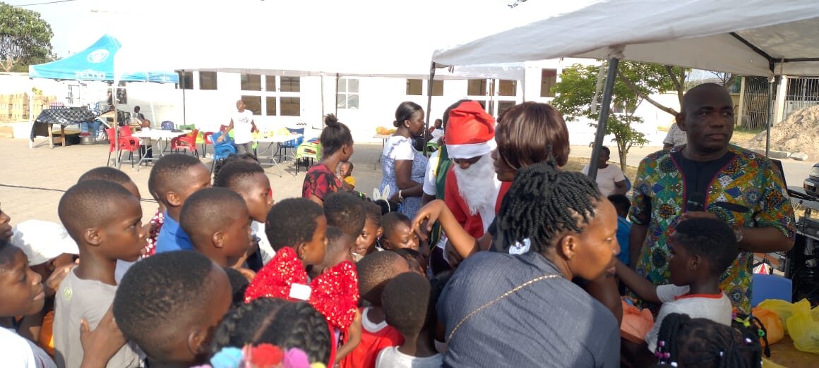 Santa greeting children at the Wells Foundation Christmas 2025 celebration in Ghana